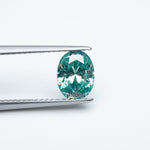 Load image into Gallery viewer, Oval teal moissanite