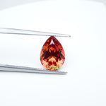 Load and play video in Gallery viewer, Pear lab grown orange sapphire