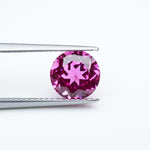 Load and play video in Gallery viewer, Round lab grown hot pink sapphire