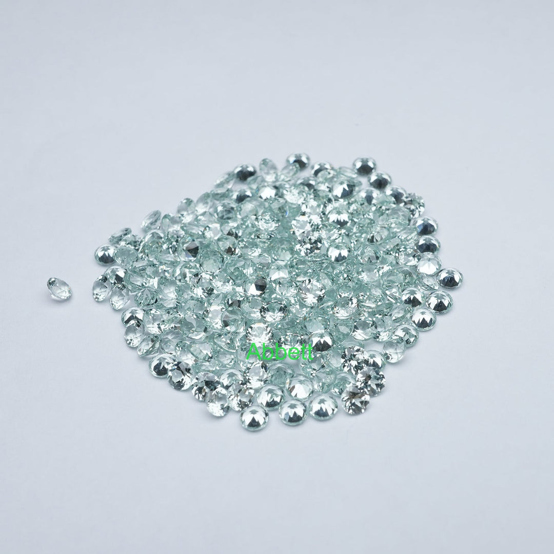 Round lab grown green sapphire melee