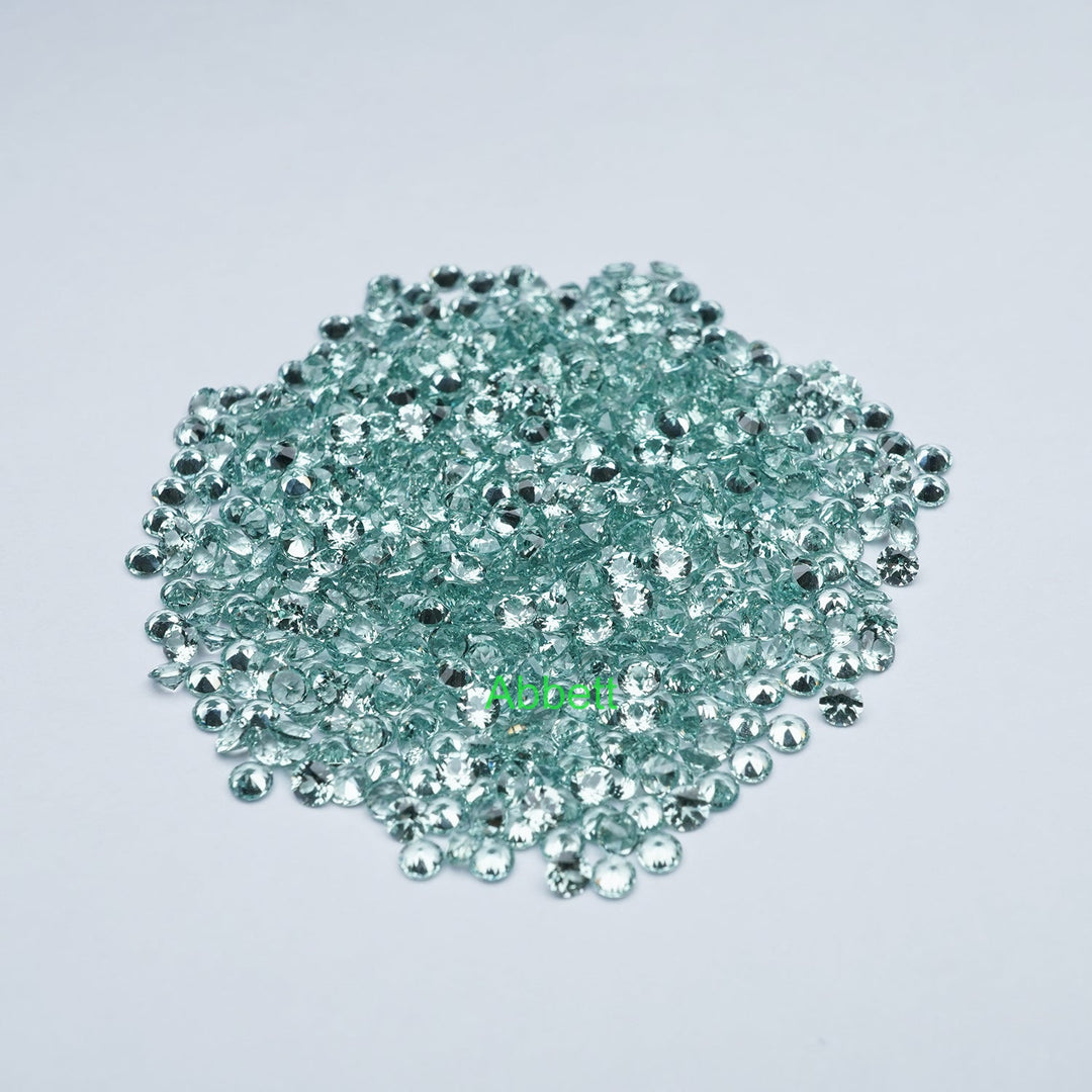 Round lab grown green sapphire melee