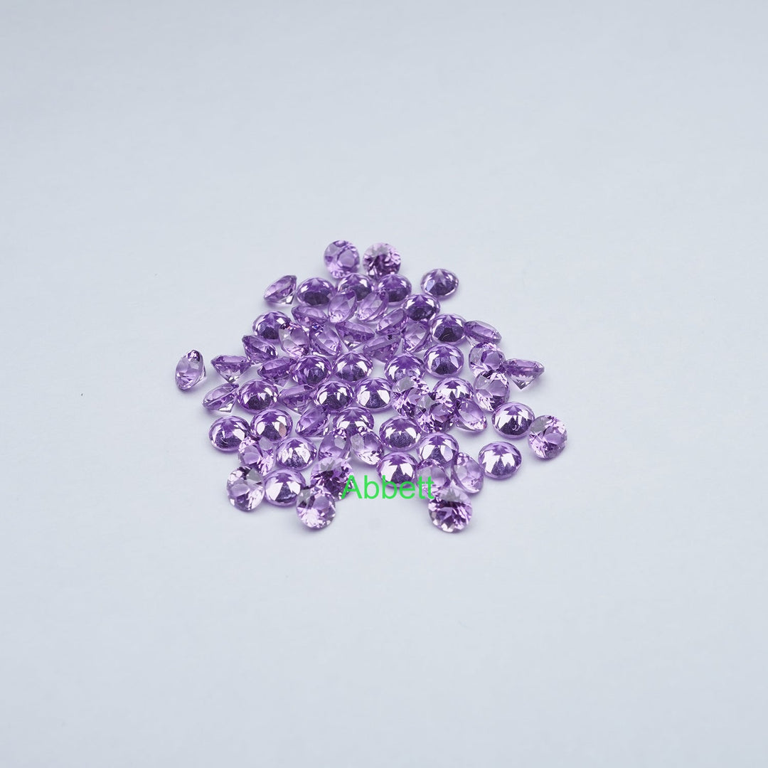 Round melee lab grown purple sapphire