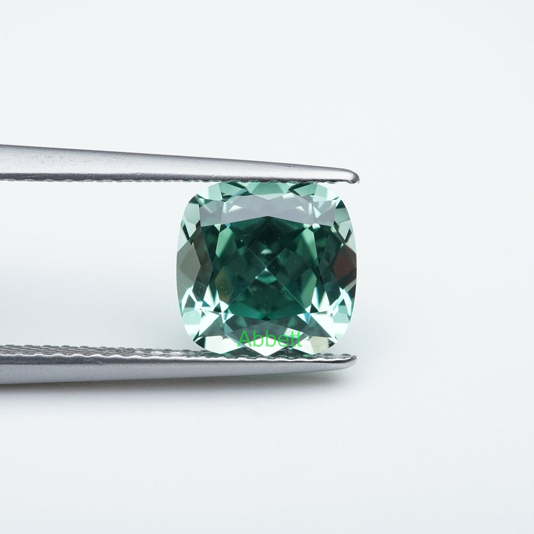 Cushion lab grown green sapphire