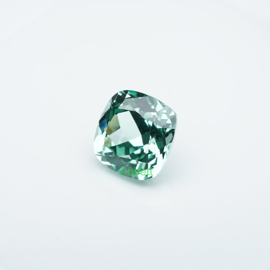 Cushion lab grown green sapphire