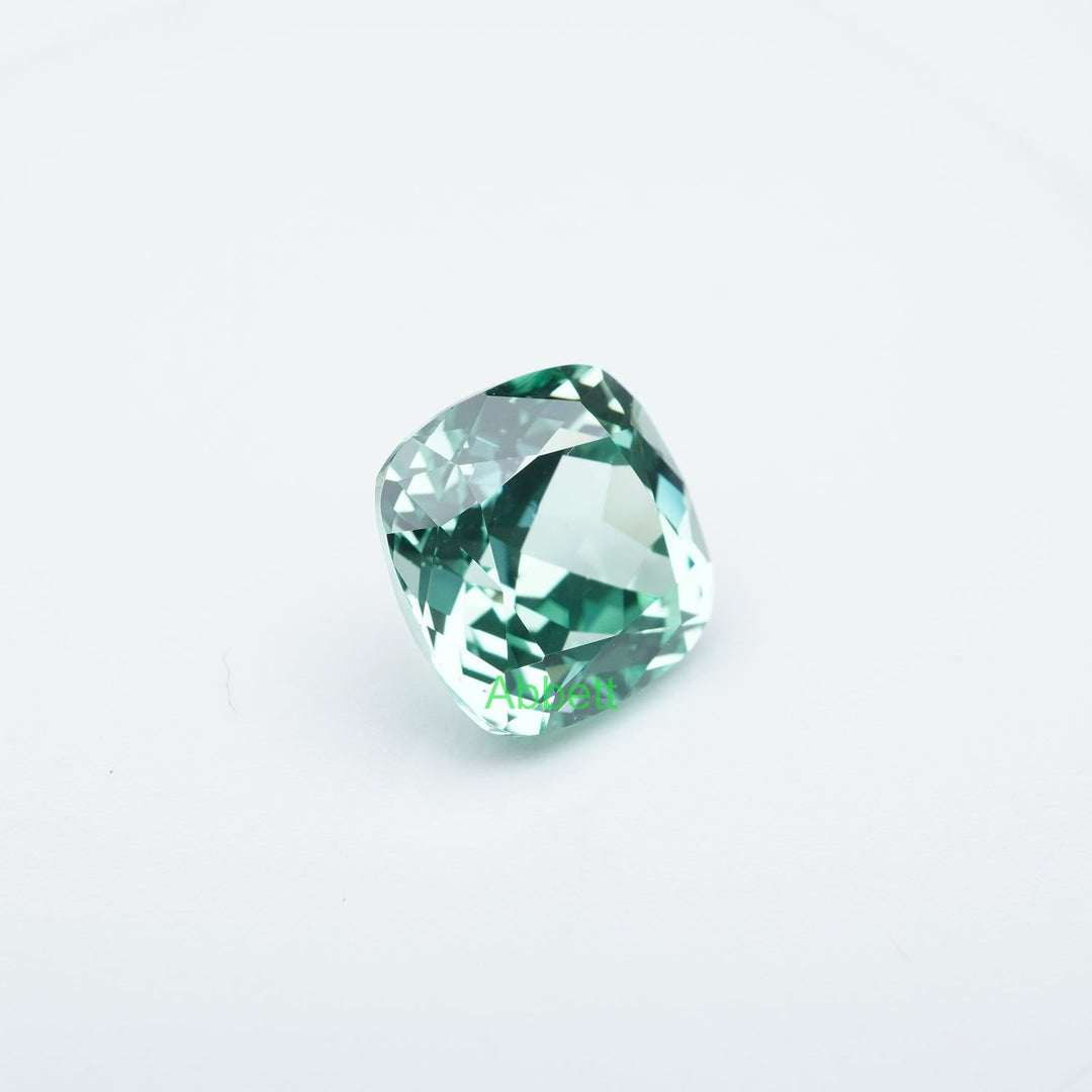 Cushion lab grown green sapphire