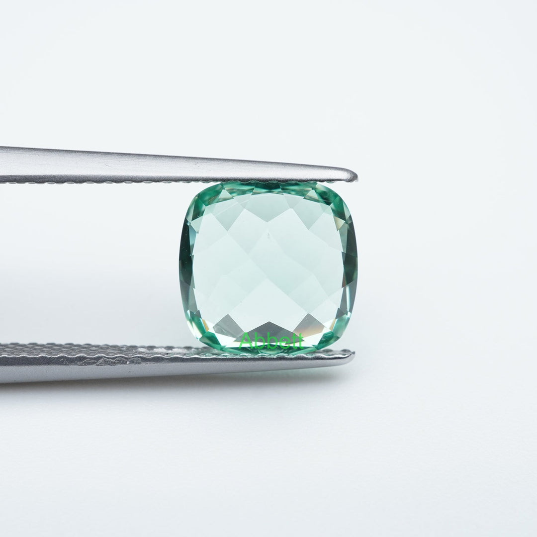 Cushion lab grown green sapphire