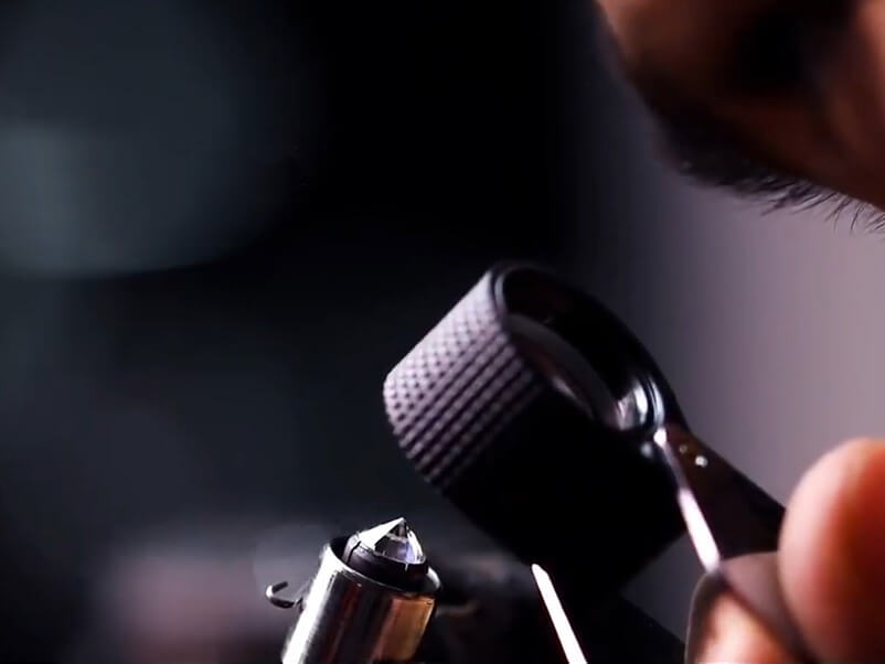 Inspecting a finished polished lab-grown diamond