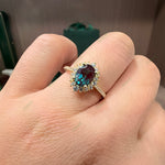 Load image into Gallery viewer, Lab Grown Alexandrite Ring | 1.5ct Oval Cut 6x8mm Sunburst Diamond Halo Engagement Ring | Color-Change Fine Jewelry