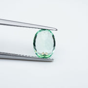 Oval lab grown green sapphire