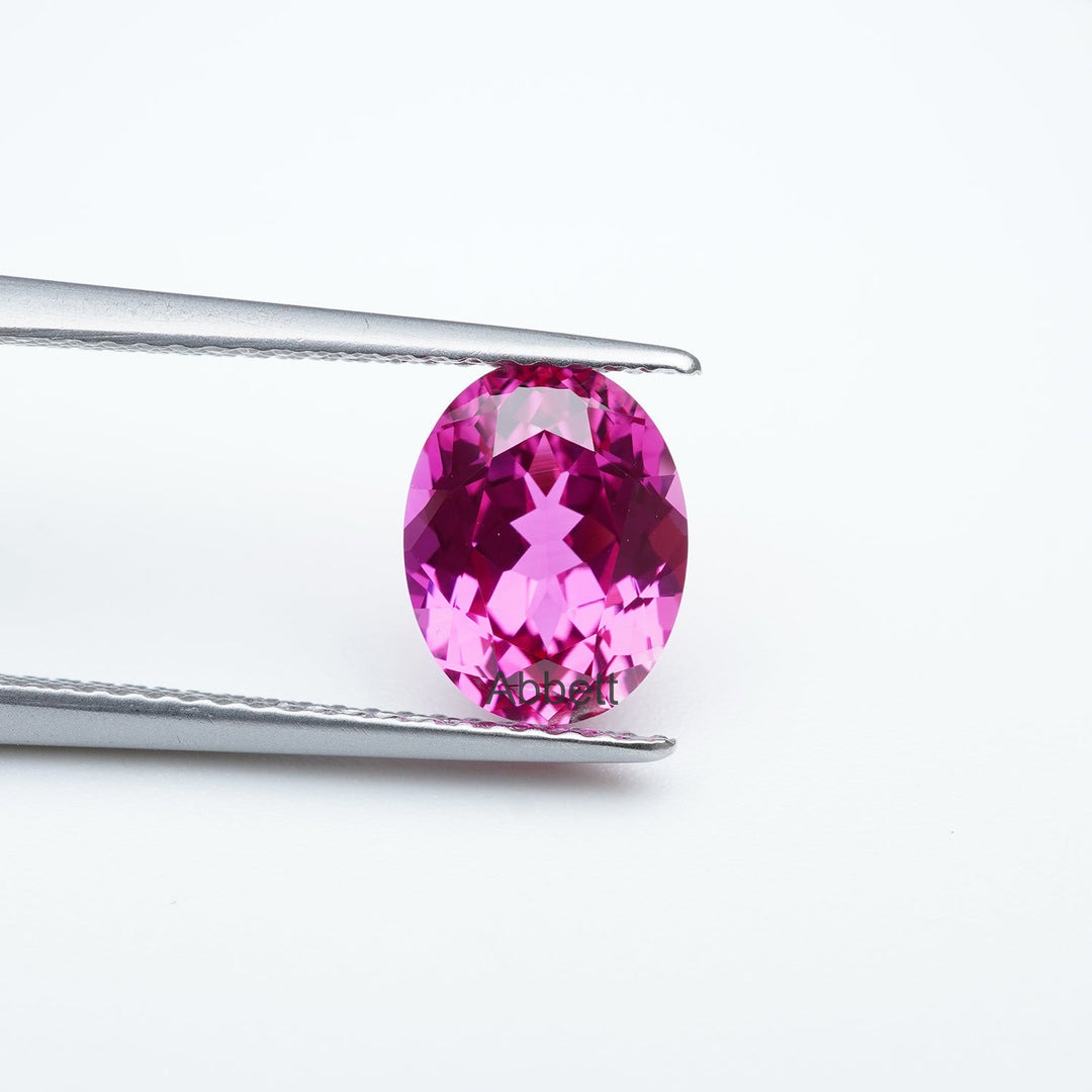 Oval lab grown hot pink sapphire