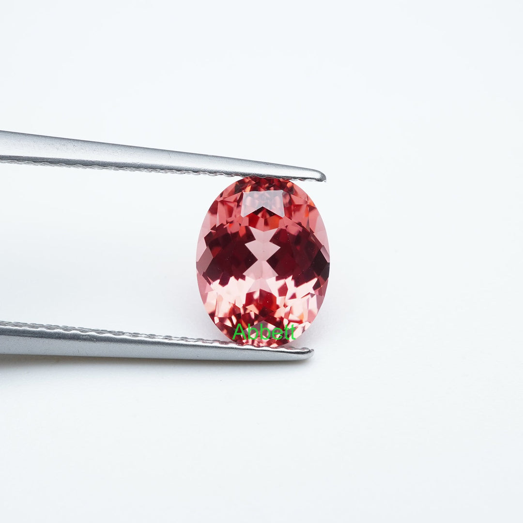 Oval lab grown padparadscha sapphire