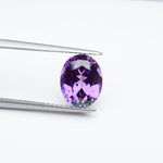 Load image into Gallery viewer, Oval lab grown purple sapphire
