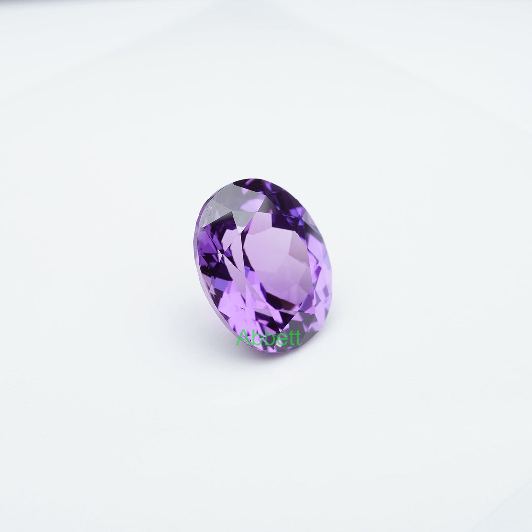 Oval lab grown purple sapphire
