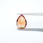 Load image into Gallery viewer, Pear lab grown orange sapphire
