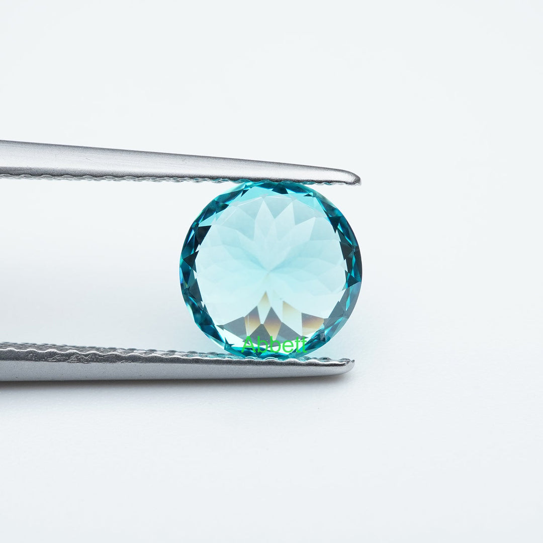 Round lab grown Paraiba YAG