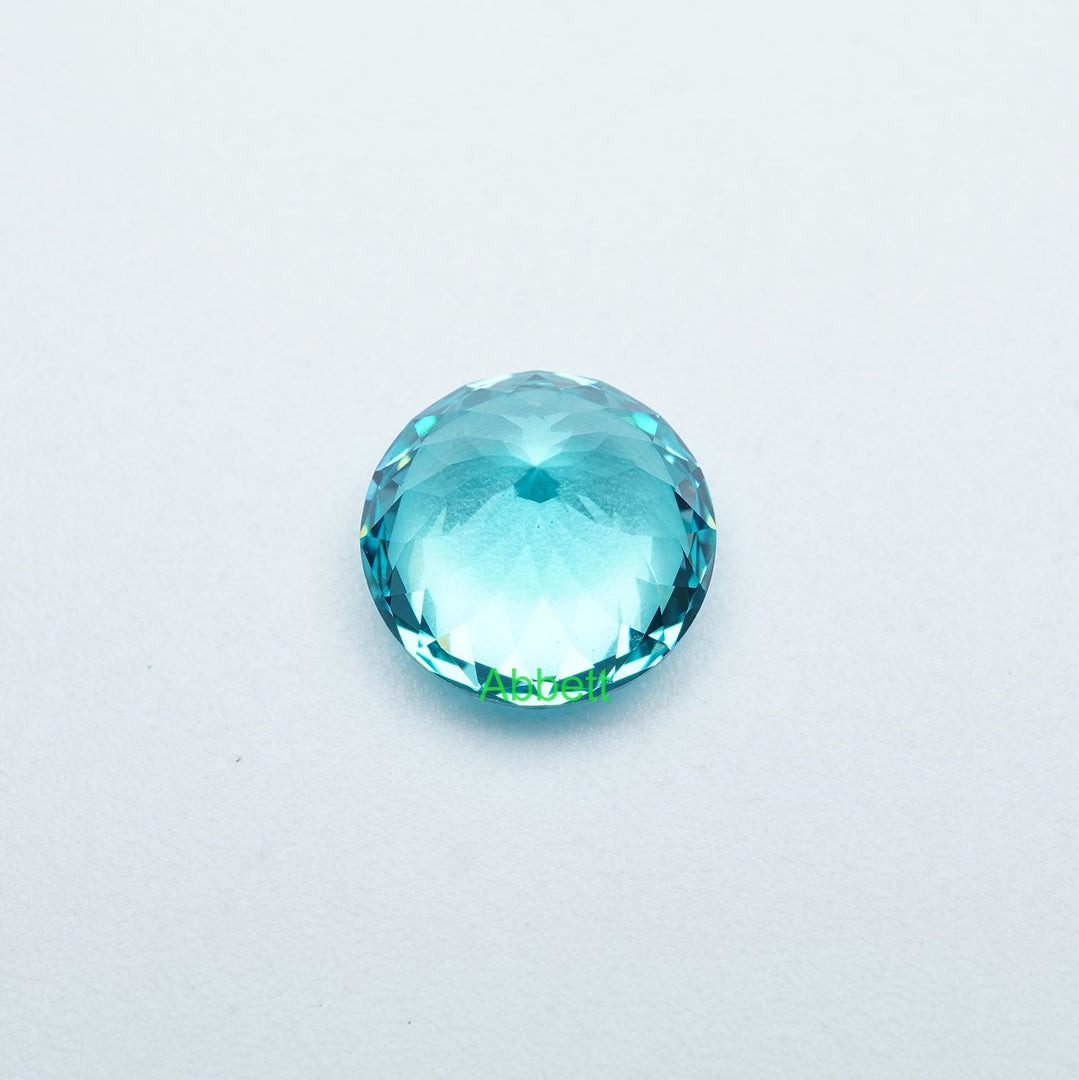 Round lab grown Paraiba YAG