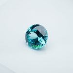 Load image into Gallery viewer, Round lab grown Paraiba YAG
