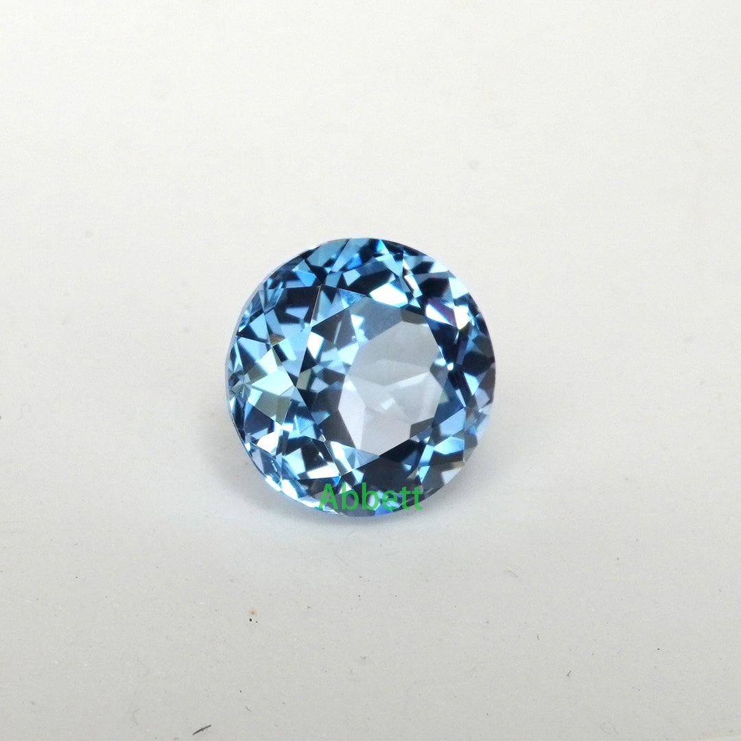 Round lab grown aqua spinel