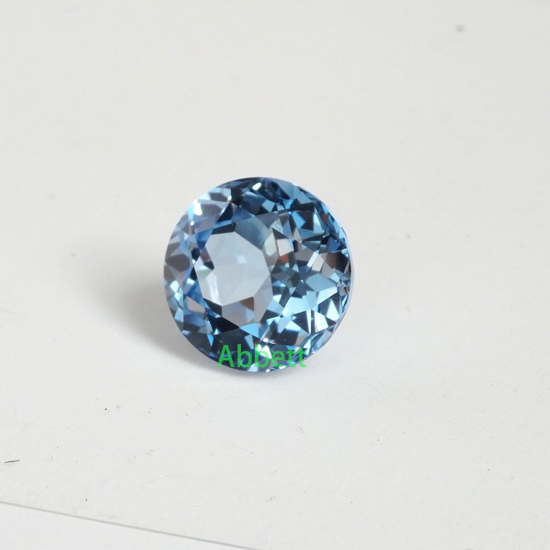 Round lab grown aqua spinel