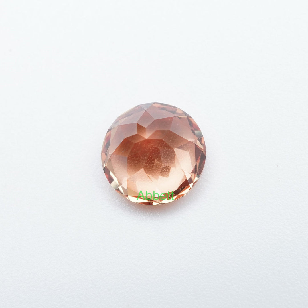 Round lab grown orange sapphire