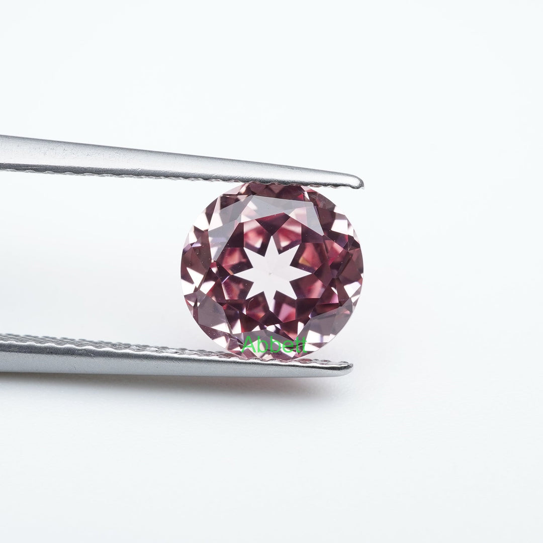 Round lab grown padparadscha sapphire