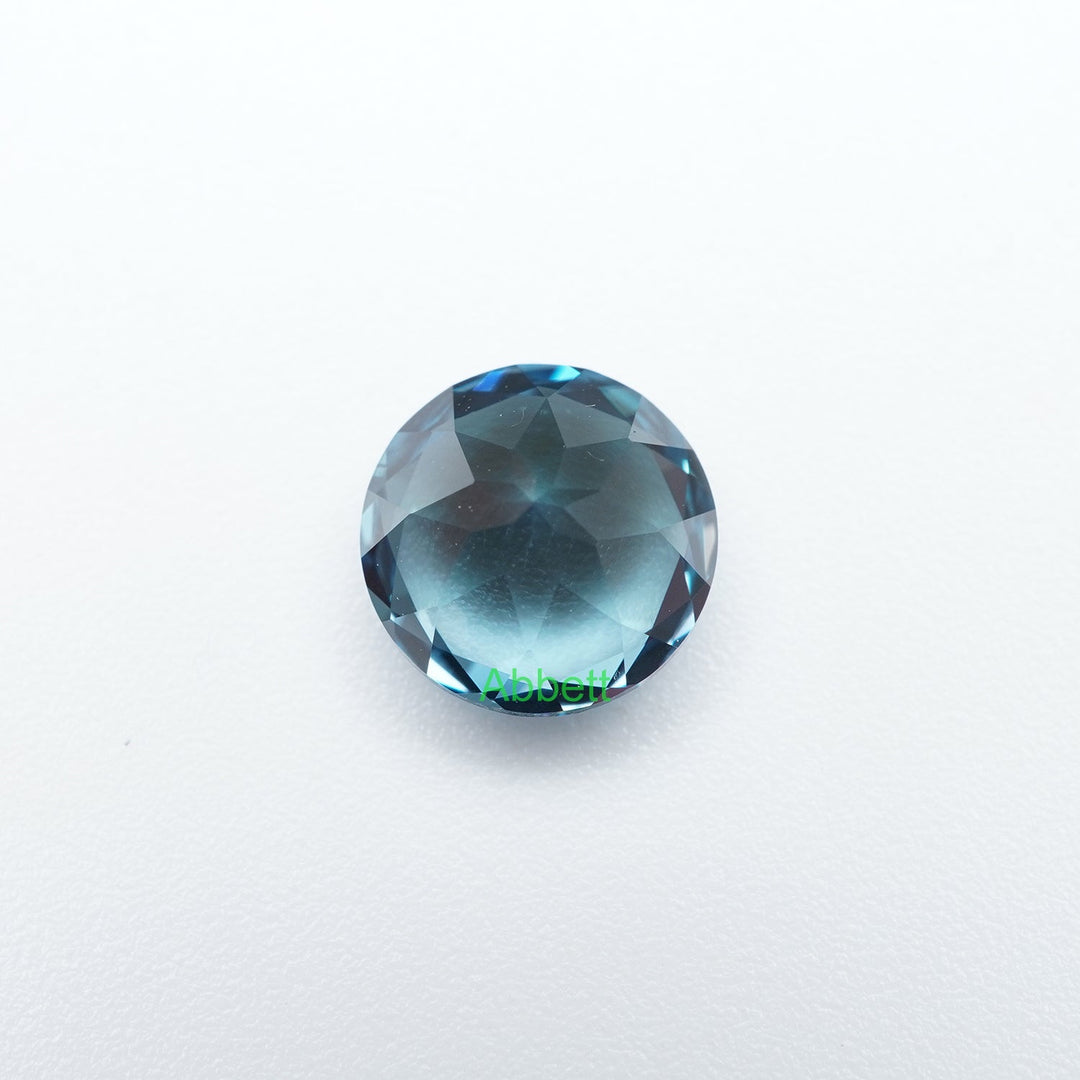Round lab grown teal sapphire