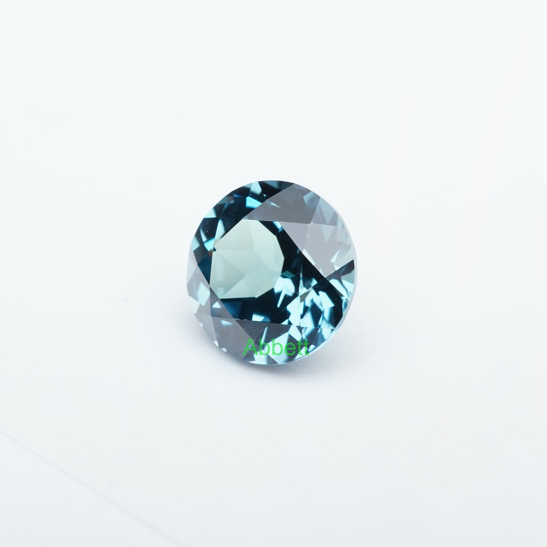 Round lab grown teal sapphire