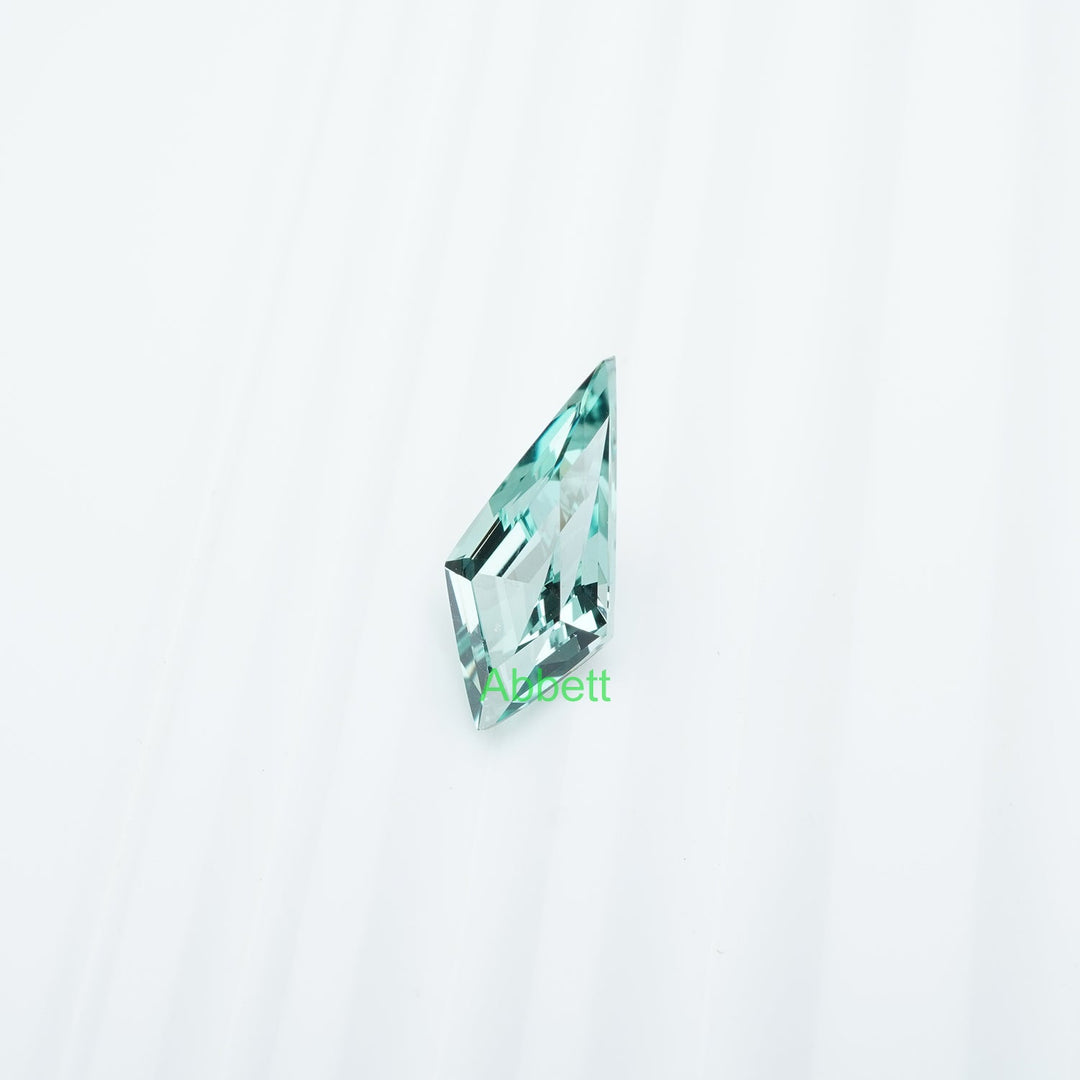 Shield lab grown green sapphire