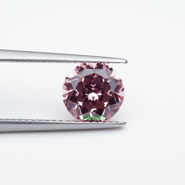 Round lab grown champagne sapphire