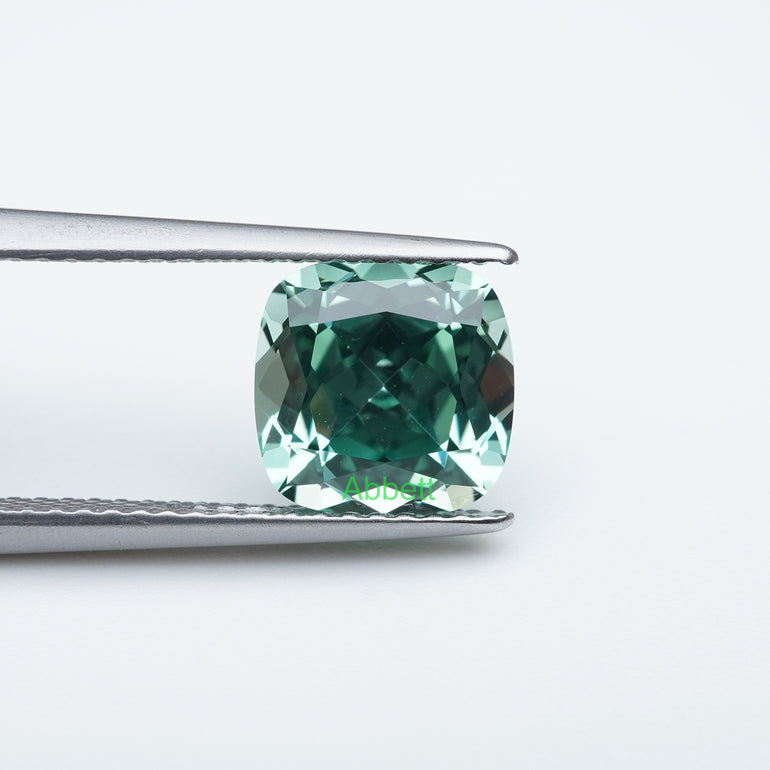 Cushion lab grown green sapphire