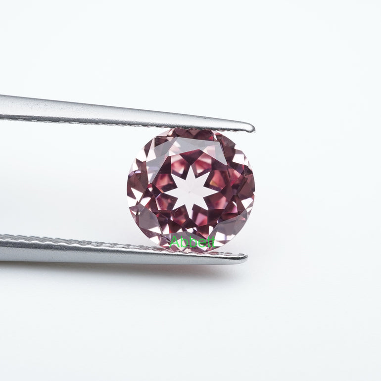 Round lab grown padparadscha sapphire