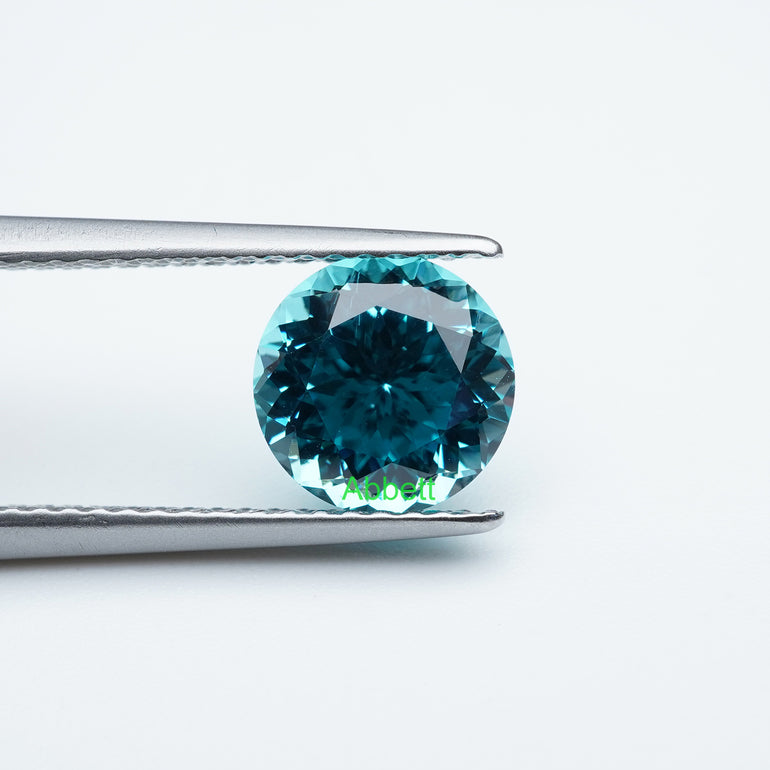 Round lab grown Paraiba YAG