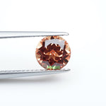 Load and play video in Gallery viewer, Round lab grown orange sapphire
